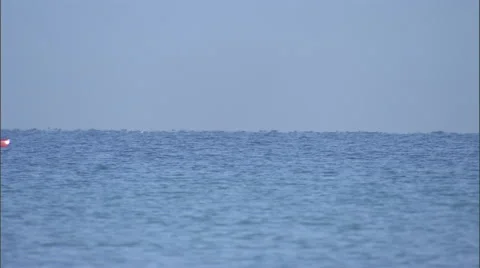 A man rowing a boat on the ocean. Stock Footage 46869031
