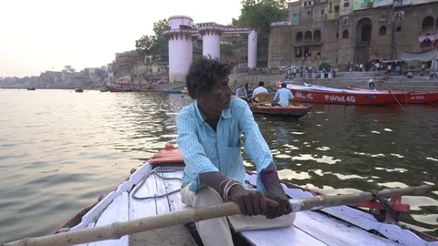 Man rowing boat on the River Ganges Stock Footage 115937676