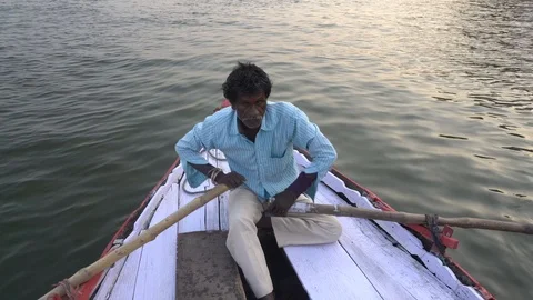 Man rowing boat on the River Ganges Stock Footage 115937684