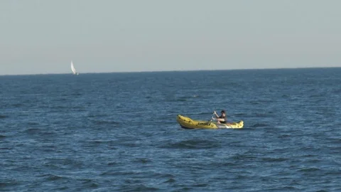 Man Rowing Boat in the Sea Stock Footage 124048101