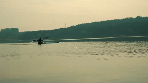 A Man Rowing In A Canoe Video stock 169869803