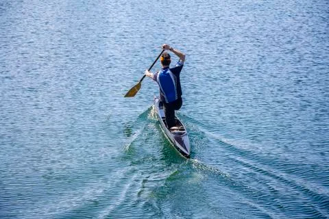 Man rowing in a canoe Foto stock