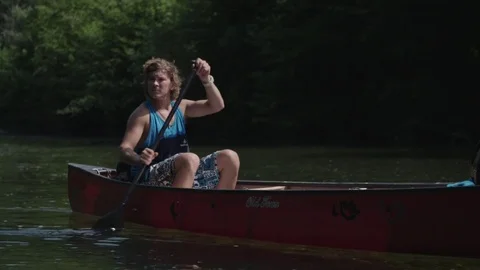 Man rowing in the canoe on the river. 스톡 동영상 76735293