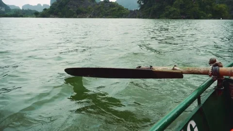Man Rowing Green Boat on Ninh Binh River with Mountain Landscape Stock Footage 340025400