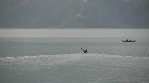 Man rowing in a kayak Stock-Footage 61543491