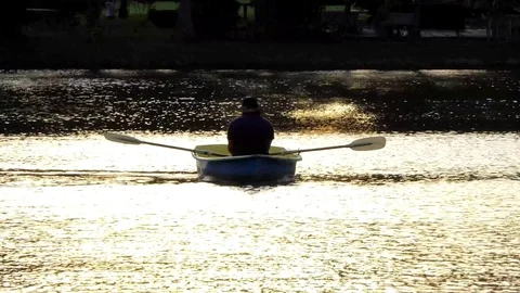 The man rowing the oars on the river. Stock Footage 79027827