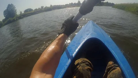 A man rowing oars sitting in a kayak. Video stock 112375828