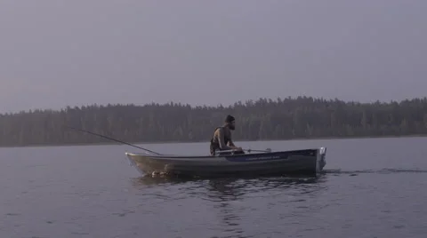 Man rowing on a wild lake Stock Footage 62757528