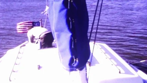 Man rows his dinghy Stock Footage 83469217