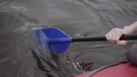 Man rows paddle in boat Stock Footage 120495207