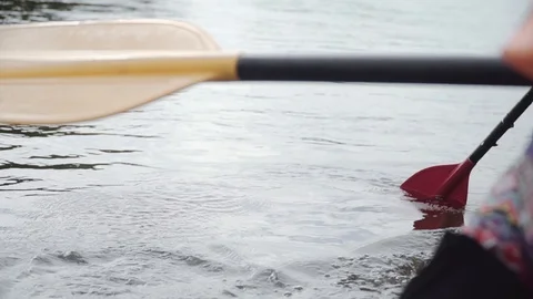 Man rows paddle in boat Stock Footage 120495760