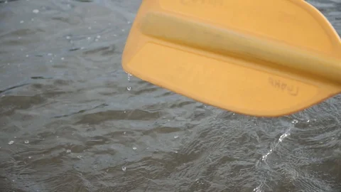 Man rows paddle in boat Stock Footage 120496080
