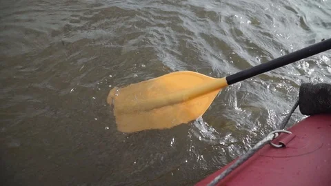 Man rows paddle in boat Stock Footage 120496120