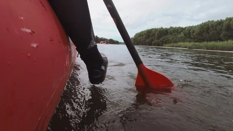 Man rows paddle in boat Stock Footage 120498129