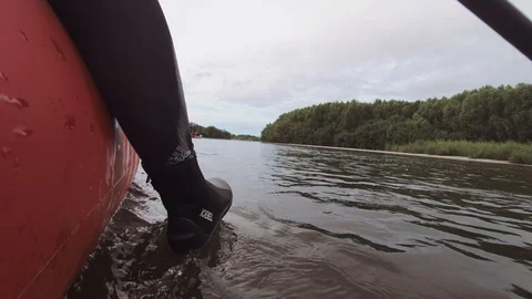 Man rows paddle in boat Stock Footage 120498545
