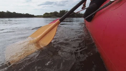 Man rows paddle in boat Stock Footage 120499174
