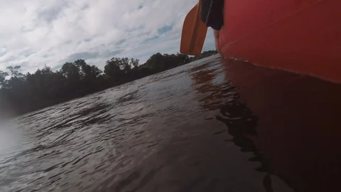 Man rows paddle in boat Stock Footage 120500370