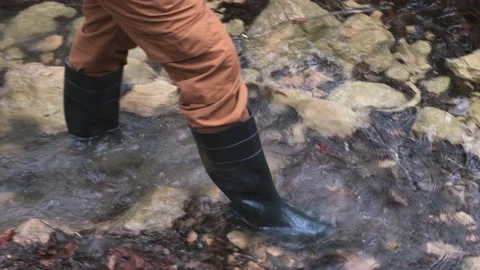 Man rubber boots river. Stock Footage 194994470