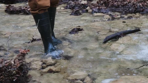 Man rubber boots river. Stock Footage 203671993