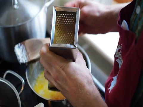 Man rubbing cheese Stock Footage 82012554