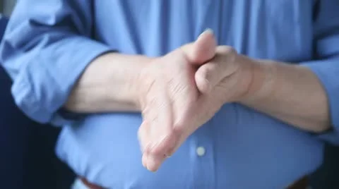 Man rubbing hands together Stock Footage 10818252