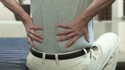 Man rubbing his back Stock Footage 61336962