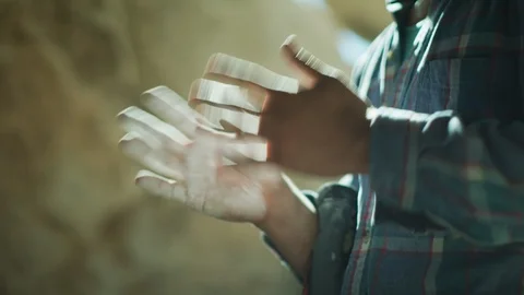 Man rubbing his hand with chalk powder Stock Footage 99740894