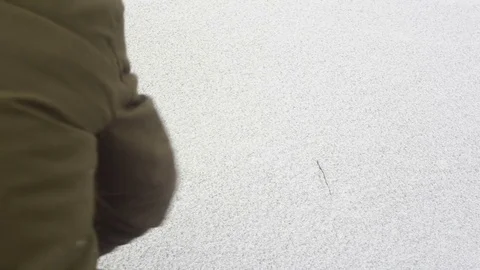 The man is rubbing the ice on the lake 스톡 동영상 84642879