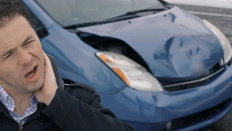 Man rubbing neck after car accident Video stock 104701441