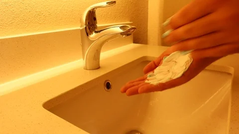 Man Rubbing Saving Cream In Hands Over Sink to Shave Stock Footage 126359130