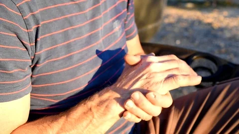 Man rubbing sore tired hands after hard day of manual labor, close-up back 2 Stock-Footage 87769455