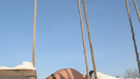 Man rubbs himself with snow in winter Stock Footage 147226744