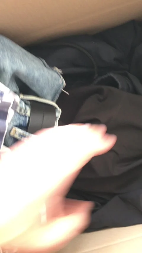 A man rummages through second-hand clothes. Fast fashion waste. Stock Footage 314710939