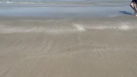 Man run along on sandy beach. Sea coast summer Stock-Footage 340298691