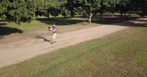 A man run and shoot video at park in Chiang Mai Thailand Stock Footage 100743924