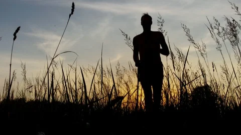 Man run on meadow Stock Footage 92938792