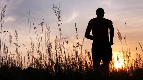 Man run on meadow Stock Footage 92939055