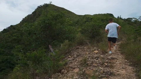 Man run outdoors on mountain Stock Footage 76487902