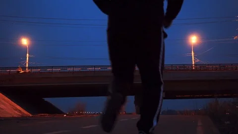 Man runner jogging in city in the evening Video stock 89403800