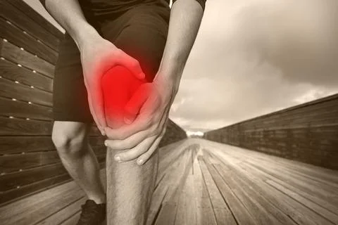Man runner with knee or joint injury. Filling pain while training. Stock Photos