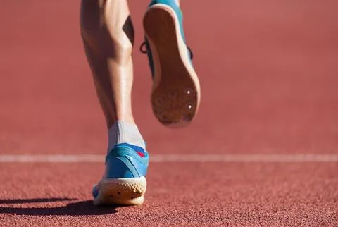 Man runner running on track Stock Photos