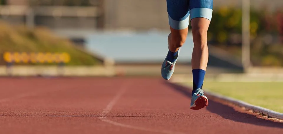 Man runner running on track Stock Photos