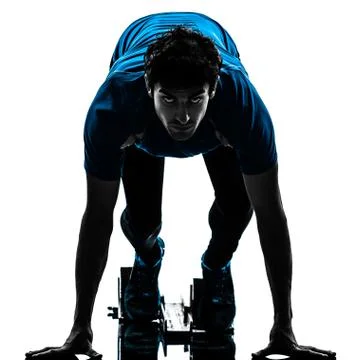 Man runner sprinter on starting blocks   silhouette Stock Photos
