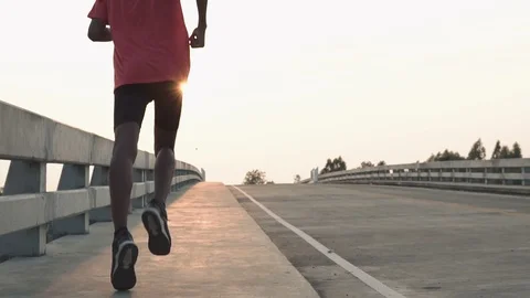 The man with runner on the street be running for exercise. Video stock 105913478