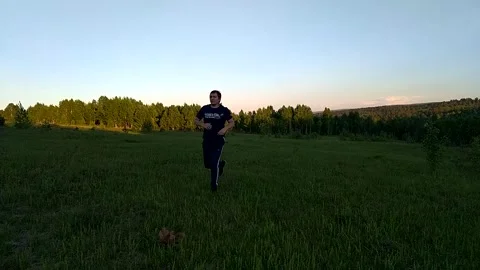 Man running across the field -2 Stock Footage 156187105