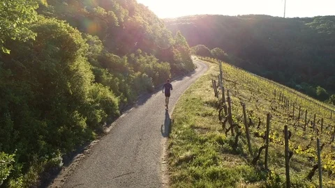 Man running against the sun Stock Footage 96703737