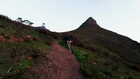 Man running along the mountain FPV Stock Footage 338228240