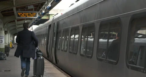 Man running to Amtrak train Stock Footage 239359711