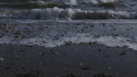 Man running bare foot on sandy beach into sea wave Stock Footage 85099402