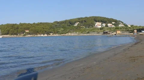 Man Running  Barefoot on Sandy Beach Stock Footage 54914797